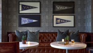 Photo of two round tables with bench seating in bar