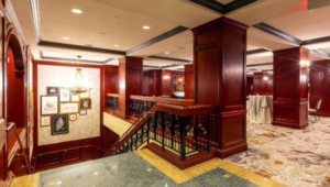 Staircase leading up from hotel registration to meeting rooms